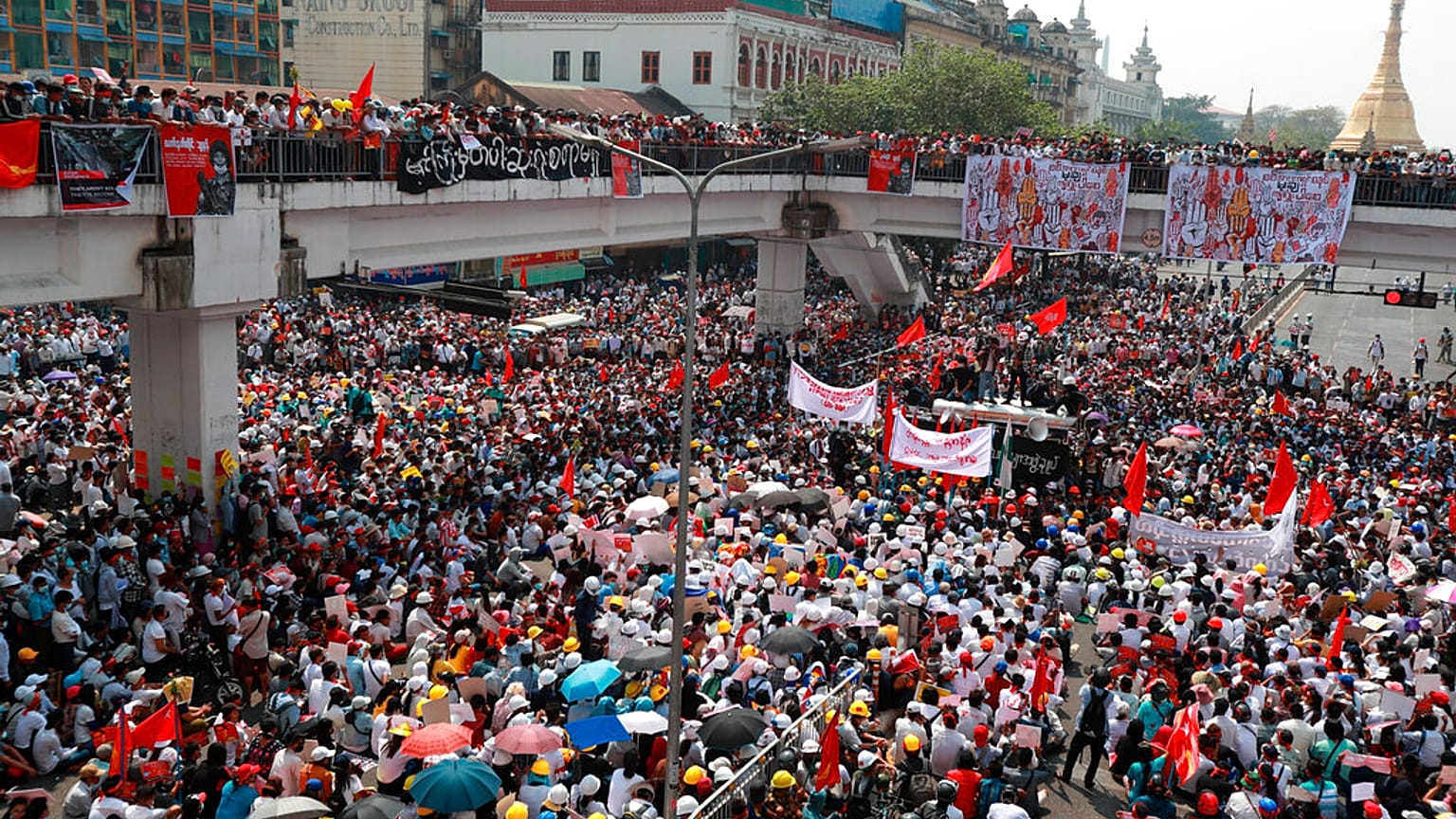 Anti-coup protesters gather at an intersection near the Sule Pagoda in downtown Yangon, Myanmar, Monday, Feb. 22, 2021.