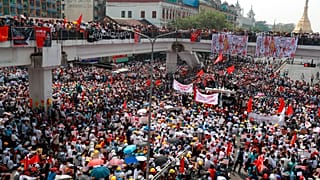 Anti-coup protesters gather at an intersection near the Sule Pagoda in downtown Yangon, Myanmar, Monday, Feb. 22, 2021.