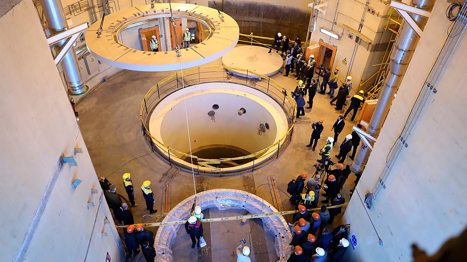 Technicians work at the Arak heavy water reactor's secondary circuit in Iran