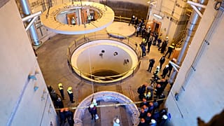 Technicians work at the Arak heavy water reactor's secondary circuit in Iran