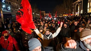 Supporters of the left-wing Self-Determination Movement party react in Pristina, the capitol of Kosovo, on Sunday, Feb. 14, 2021.