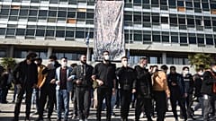 Protesters chant slogans at the University of Thessaloniki in northern Greece, on Monday, Feb. 22, 2021