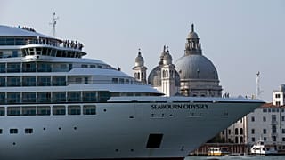 A cruise ship manoeuvres through the Giudecca canal in front of St. Mark's Square, in Venice, Italy. 