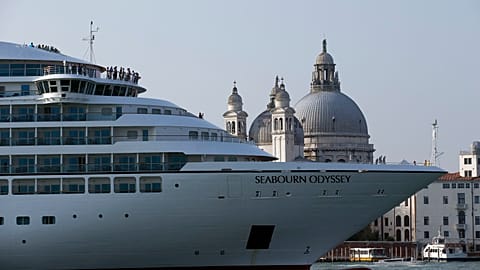 A cruise ship manoeuvres through the Giudecca canal in front of St. Mark's Square, in Venice, Italy. 