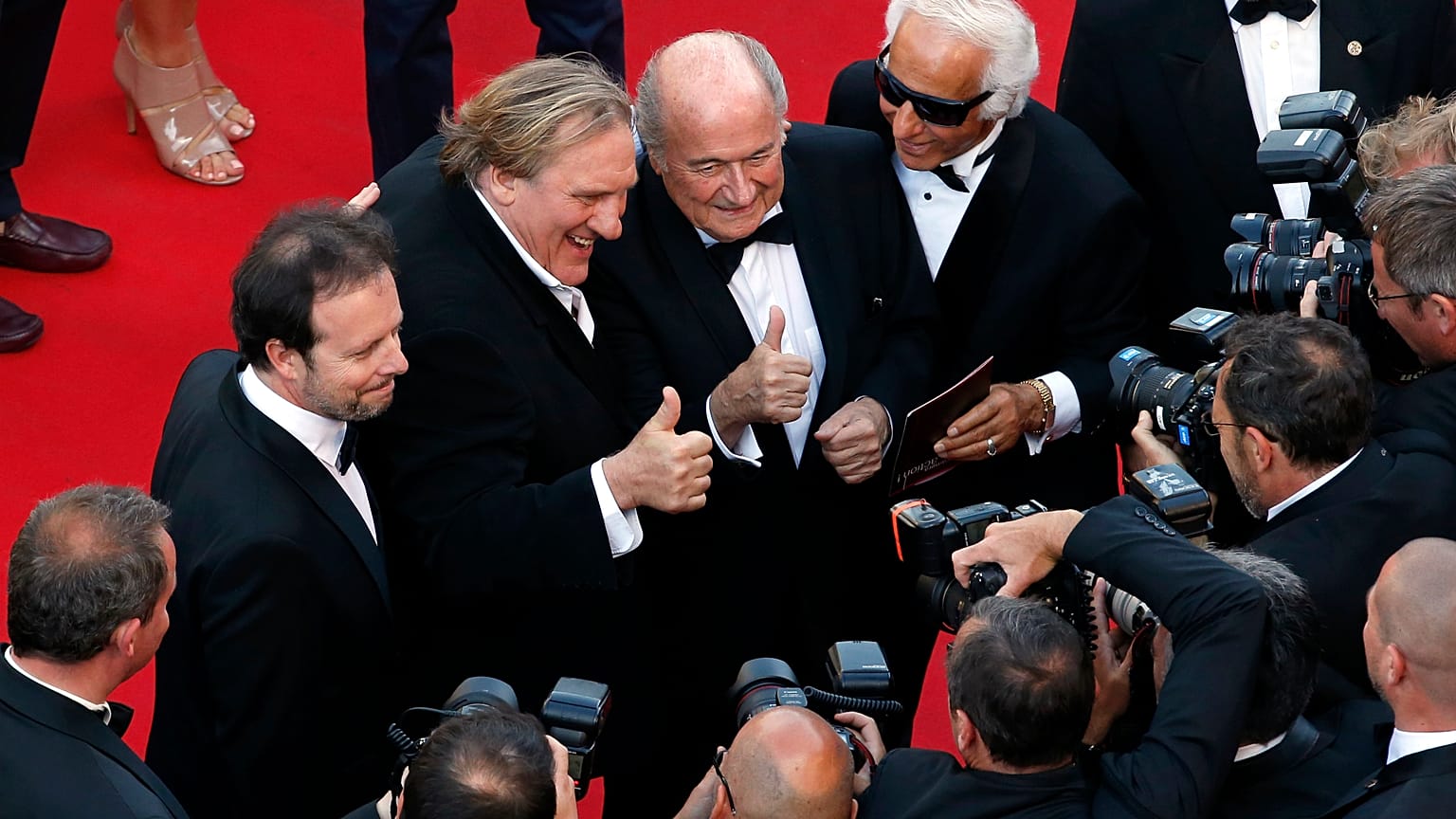 Gérard Depardieu en compgnie de Sepp Blatter et Frederic Auburtin lors du 67ème festival de Cannes, le 18 mai 2014, France