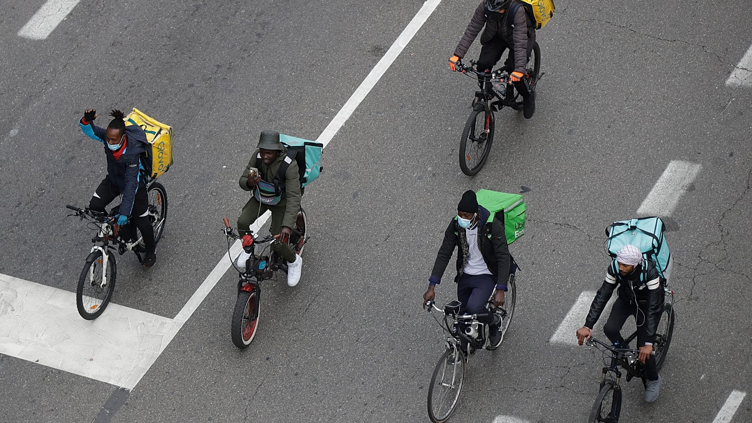 In this Nov. 5, 2020 file photo, food delivery riders stage a protest against the government restriction measures to curb the spread of coronavirus in Milan, Italy.