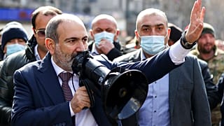 Armenian Prime Minister Nikol Pashinyan speaks through a loudspeaker during a rally in the central in Yerevan, Armenia,