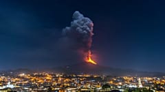 Flames and smoke billowing from a crater of the Mount Etna volcano, Sicily. February 24, 2021