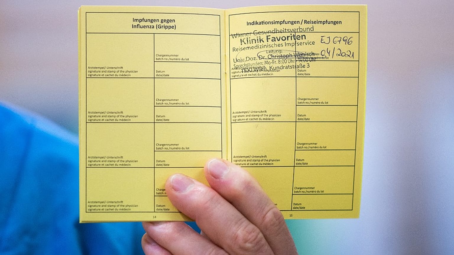 Medical personnel hods a vaccination certificate with a registered Pfizer-Biontech Covid-19 corona virus vaccination at the Favoriten Clinic in Vienna, Austria