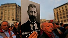 Protesters hold portraits of Armenian intellectuals during a rally to commemorate the anniversary of the 1915 mass killings.