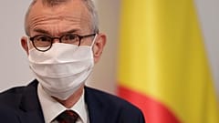 Belgium's Minister of Health and Social Affairs Frank Vandenbroucke wears a facemask during an October press conference.