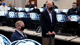 President Joe Biden tours the Harris County Emergency Operations Center with Texas Gov. Greg Abbott, Friday, Feb. 26, 2021, in Houston.