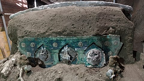 A view of a chariot, with its iron elements, bronze decorations and mineralized wooden remains, that was found in Civita Giuliana, north of Pompeii.