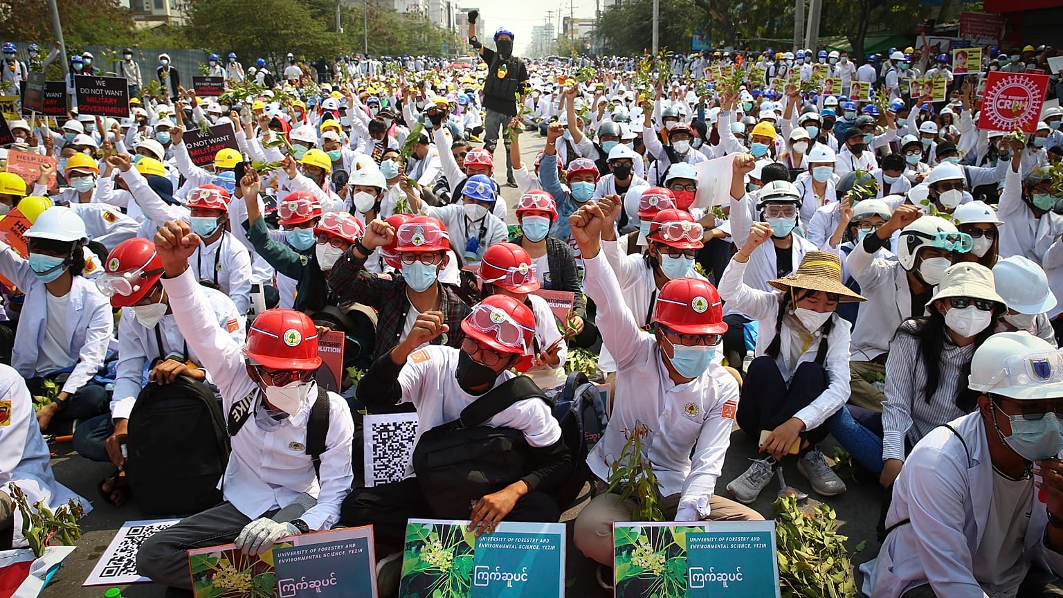 Protesters shout slogans during a protest against the military coup in Mandalay, Myanmar, Sunday, Feb. 28, 2021.