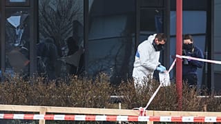 Forensic investigators search for evidence after an explosion at a Covid-19 testing centre in the town of Bovenkarpsel