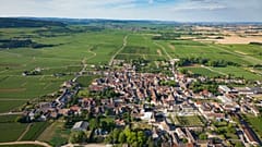 Aerial view of the village of Puligny Montrachet and surrounding vineyards