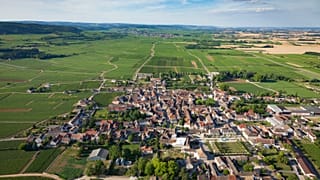 Aerial view of the village of Puligny Montrachet and surrounding vineyards