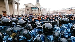 Jan. 31, 2021 file photo, people clash with police during a protest against the jailing of opposition leader Alexei Navalny in Moscow, Russia.