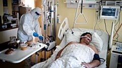 A medic takes care of a Covid-19 patient hospitalised at Covid-19 ICU of the Pulmonology department of the Hospital Ruzinov in Bratislava, Slovakia on February 24, 2021.