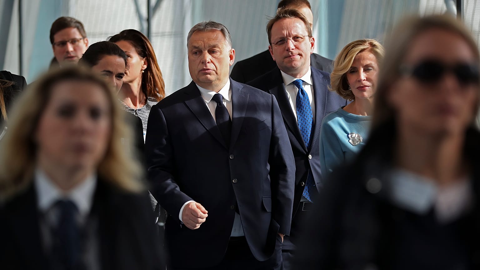 In this Wednesday, March 20, 2019 file photo, Hungarian Prime Minister Viktor Orban, center, arrives to a European People's Party's meeting in Brussels.