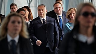 In this Wednesday, March 20, 2019 file photo, Hungarian Prime Minister Viktor Orban, center, arrives to a European People's Party's meeting in Brussels.