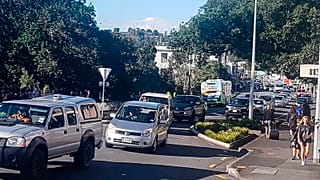 Traffic slowly works up to high ground at Whangarei, New Zealand, as a tsunami warning is issued Friday, March 5, 2021.