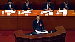Chinese Premier Li Keqiang delivers a speech during China's National People's Congress (NPC) at the Great Hall of the People in Beijing, Friday, March 5, 2021. 