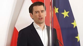 Austrian Chancellor Sebastian Kurz speaks behind plexiglass shields during a press conference at the federal chancellery in Vienna, Austria, Friday, March 5, 2021.