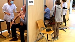 A man receives a Pfizer/BioNTech vaccine against the COVID-19 in a vaccination center of Bayonne, southwestern France.