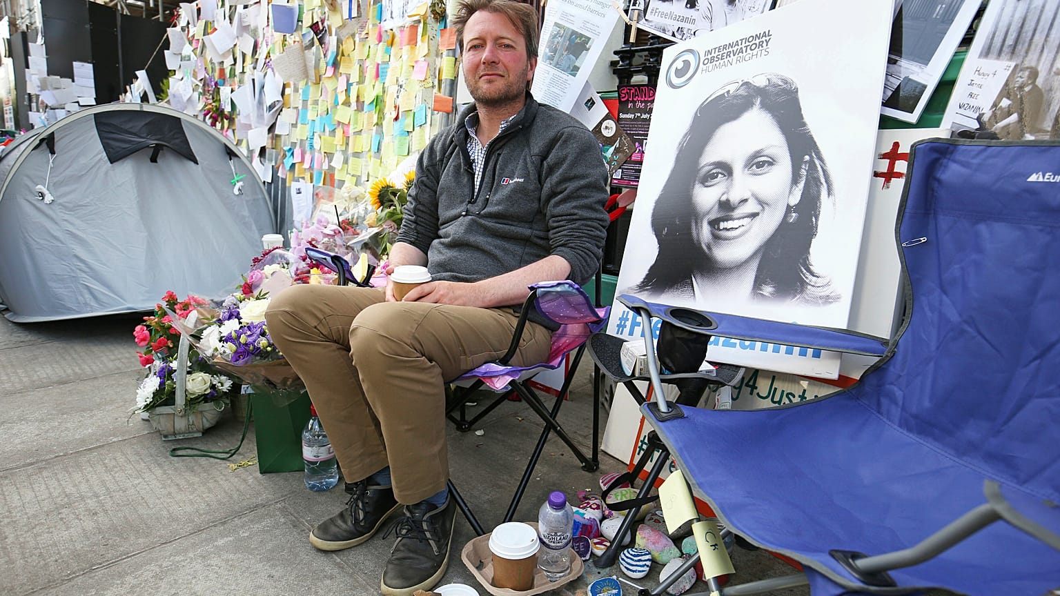 Richard Ratcliffe, the husband of detained Nazanin Zaghari Ratcliffe, seen in poster, outside the Iranian Embassy in London, Saturday June 29, 2019