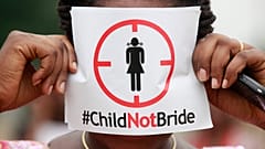 A woman protests against underage marriage in Lagos, Nigeria on July 20, 2013.