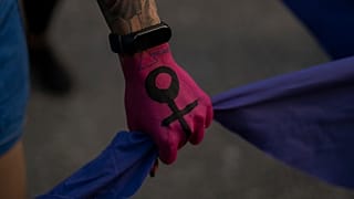 A woman participate in a march to commemorate International Women's Day 