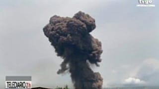 TVGE image made from video shows smoke rising over the blast site at a military barracks in Bata, Equatorial Guinea, Sunday, March 7, 2021.