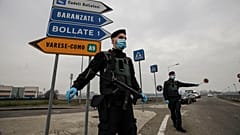 File photo: Carabinieri officers patrol one of the main access road to Bollate, in the outskirts of Milan, Italy. Feb 18, 2021.