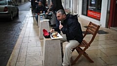 People lunch outside a pizza restaurant in Marignane, southern France, Monday Feb.1, 2021