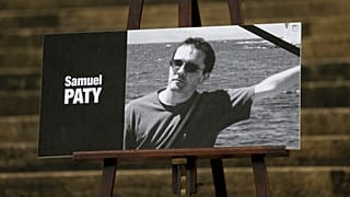 The portrait of Samuel Paty displayed on the steps of the National Assembly in Paris.