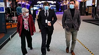 From right, MEPs Antoni Comin, Carles Puigdemont and Clara Ponsati speak with each other prior to a media conference at the European Parliament in Brussels. March 9, 2021., 