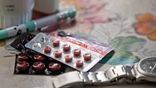 FILE PHOTO: vitamins and hypertensive medicine lay on the table