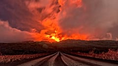 A glowing river of lava gushes from the slopes of Mt Etna, Europe's largest active volcano, near Zafferana Etnea, Sicily