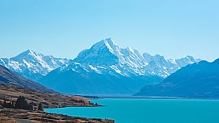 The instantly recognisable clear, blue waters and breath-taking mountains of New Zealand.