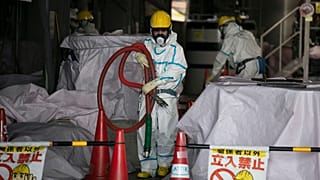 Archive image of a worker at a water treatment facility at the Fukushima nuclear power plant, Japan