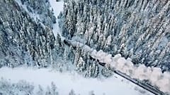 A traditional steam train chugs its way through Karelia, Russia.