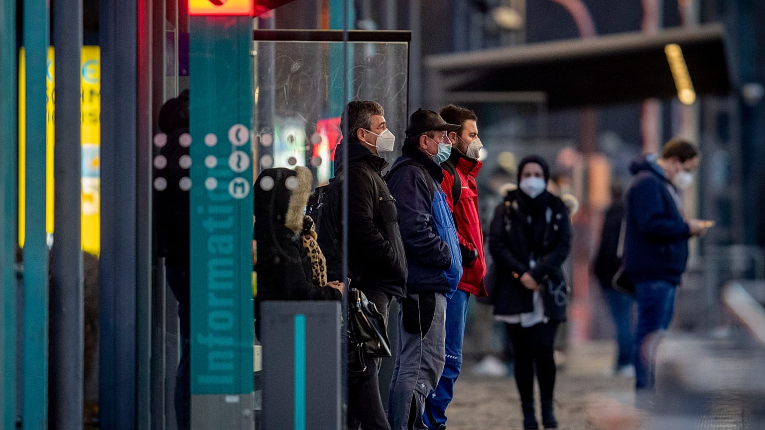 People wearing face masks wait for a train at a subway station in Frankfurt, Germany, Friday, March 12, 2021, as the number of Corona infections in Germany rises again.