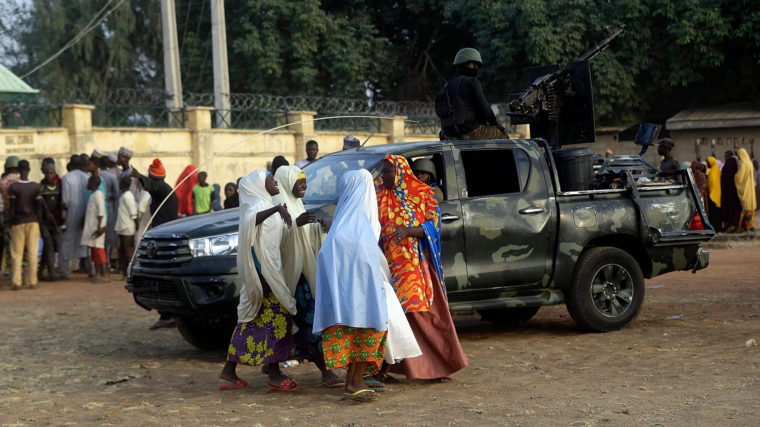 Parents are reunited with their daughters in Jangabe, Nigeria, Wednesday, March 3, 2021. 