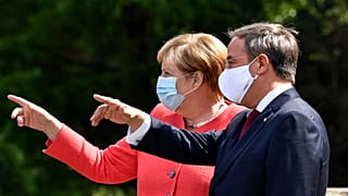 German chancellor Angela Merkel, left, and her successor as chairman of the German Christian Democratic Union, CDU, Armin Laschet.