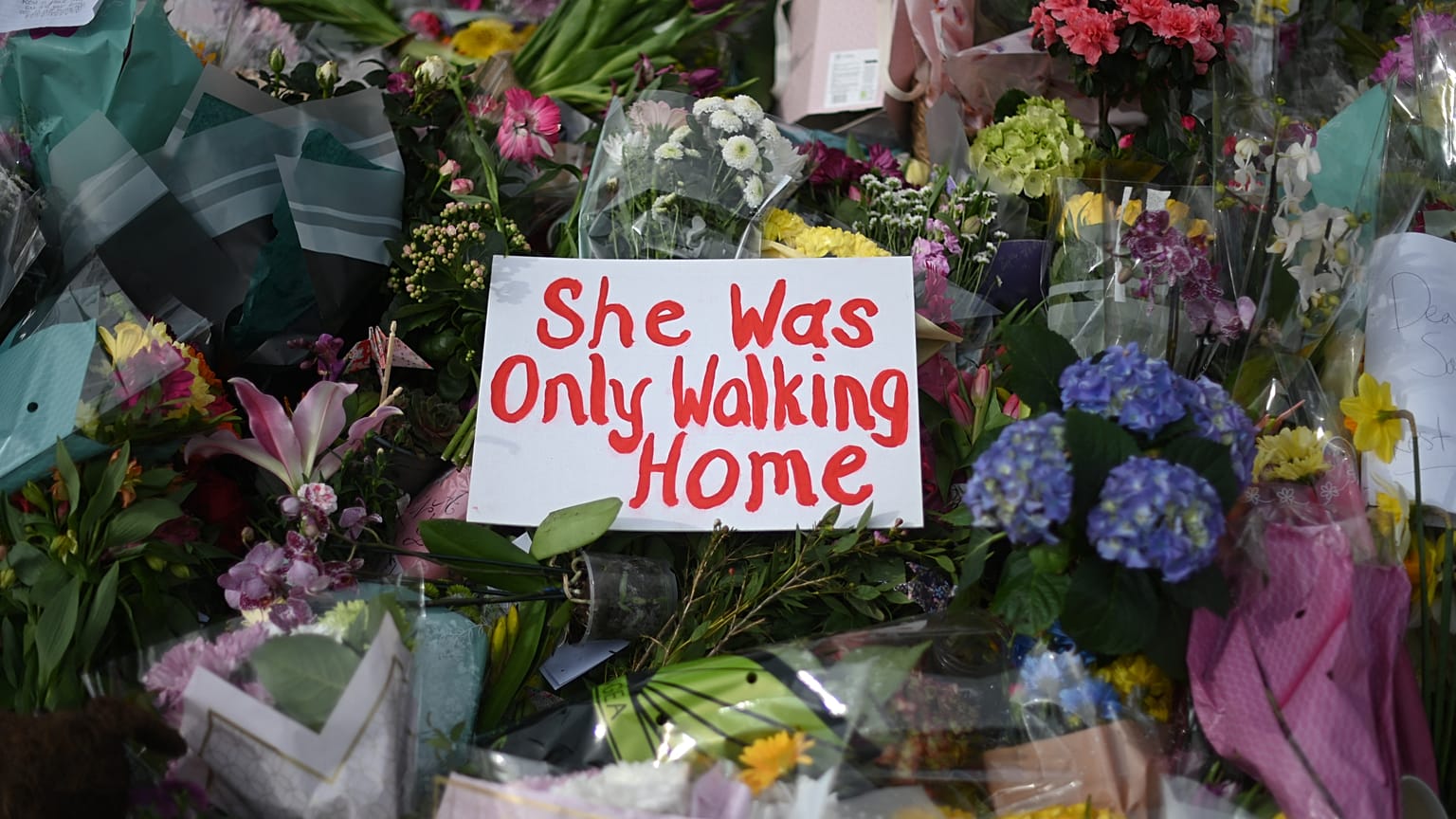 A picture shows messages and floral tributes left by well-wishers to honour alleged murder victim Sarah Everard at the bandstand on Clapham Common