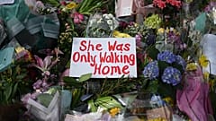 A picture shows messages and floral tributes left by well-wishers to honour alleged murder victim Sarah Everard at the bandstand on Clapham Common
