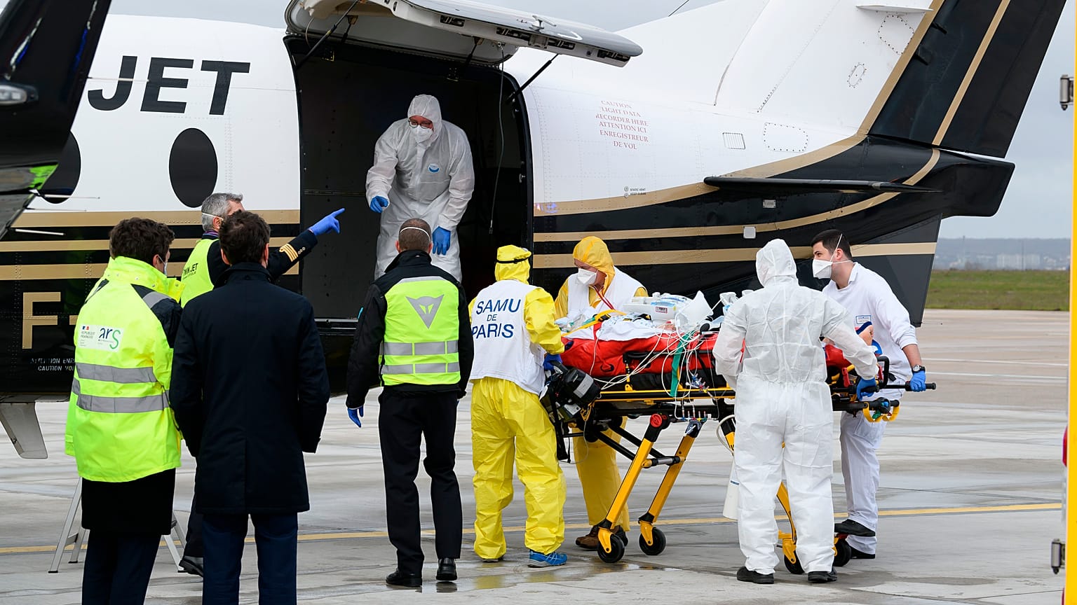 A patient infected with COVID-19 is loaded into a plane heading to a western France hospital, at Orly airport, south of Paris, Sunday, March 14, 2021.