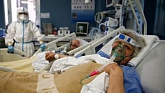 Husband and wife Giuseppe and Rosina hold hands in the Covid Intensive Care of the San Filippo Neri hospital in Rome, March 16, 2021. 