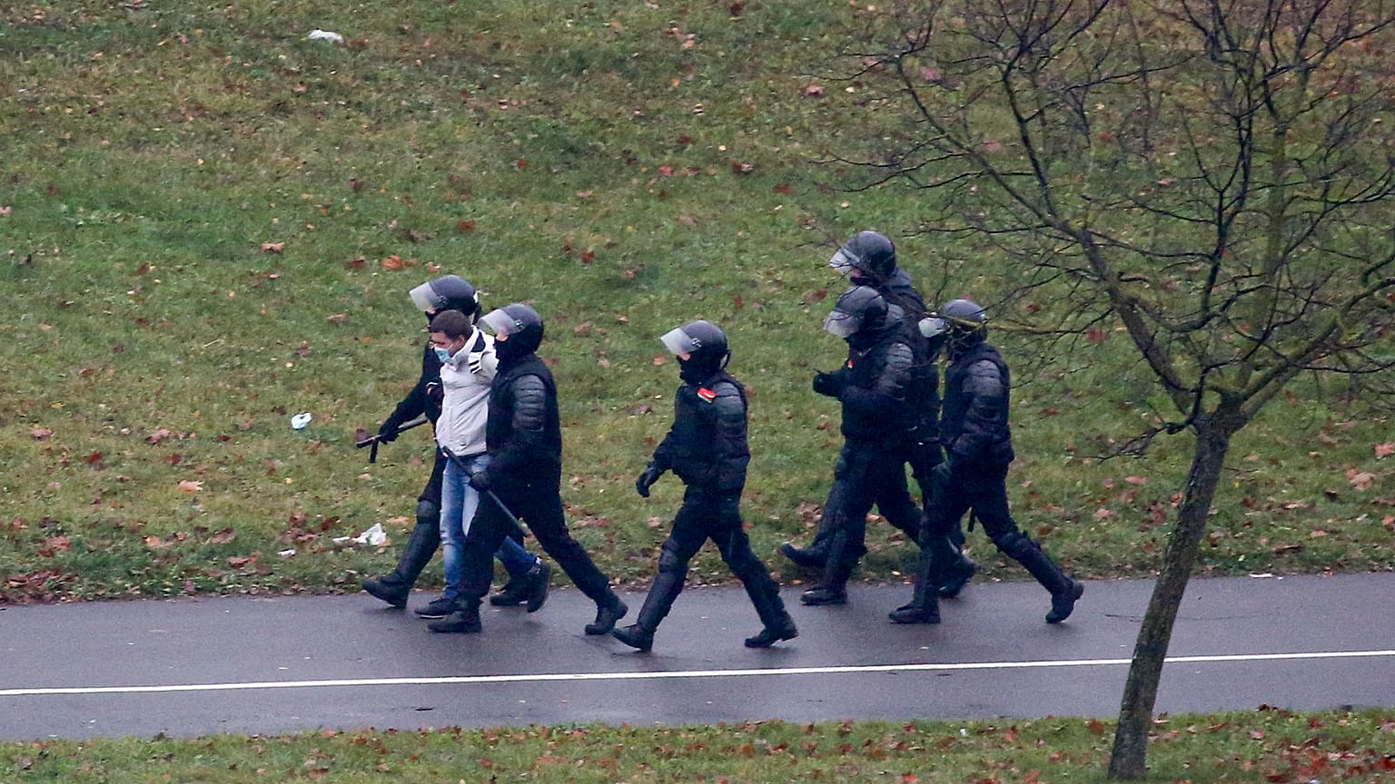 Belarusian riot police detain a demonstrator during an opposition rally in Minsk in November.